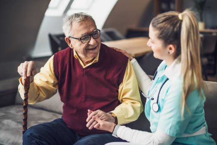 Senior with Caregiver in Memory Care at Kauhale Heritage Woods in Mobile